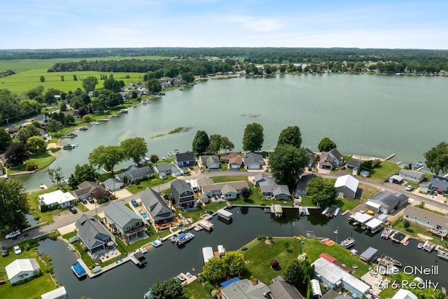 birds eye view of property featuring a water view and a residential view