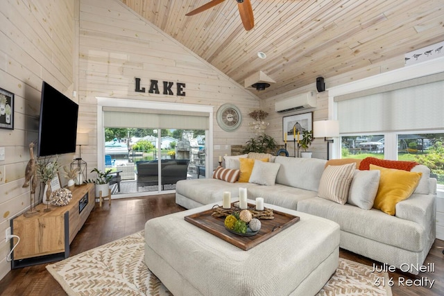 living area with wood ceiling, plenty of natural light, high vaulted ceiling, an AC wall unit, and wooden walls