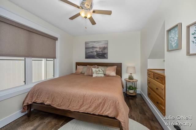 bedroom featuring baseboards, a ceiling fan, and wood finished floors