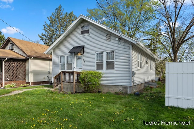 bungalow-style home featuring a front yard