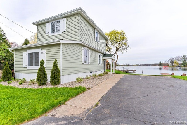 1319 Rochester Rd, Leonard, MI 48367 - view of home's exterior with a water view