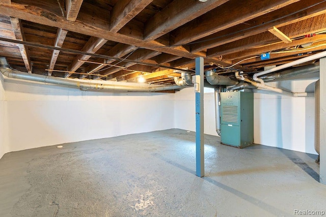 1319 Rochester Rd, Leonard, MI 48367 - unfinished below grade area featuring heating unit