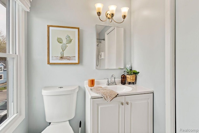 1319 Rochester Rd, Leonard, MI 48367 - bathroom with vanity, toilet, and a chandelier