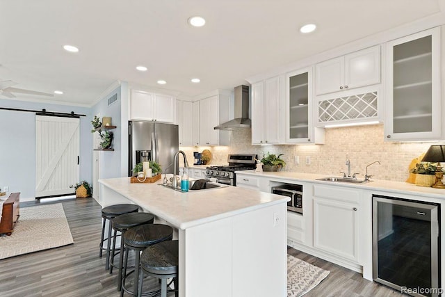 1319 Rochester Rd, Leonard, MI 48367 - kitchen featuring wine cooler, stainless steel appliances, wall chimney exhaust hood, a sink, and crown molding