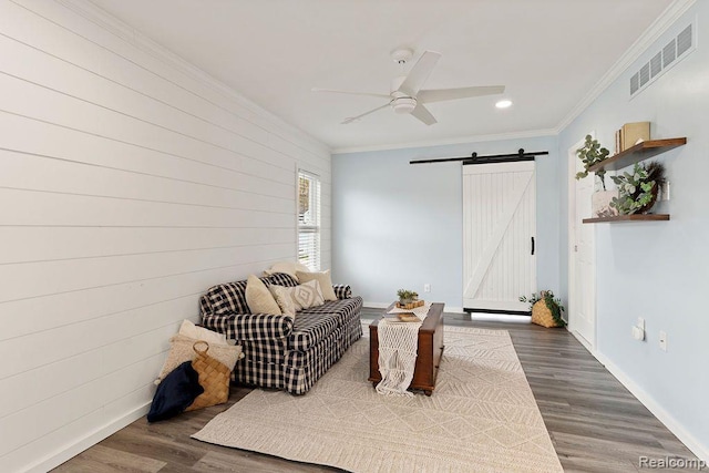 1319 Rochester Rd, Leonard, MI 48367 - living area featuring a barn door, crown molding, recessed lighting, a ceiling fan, and wood finished floors