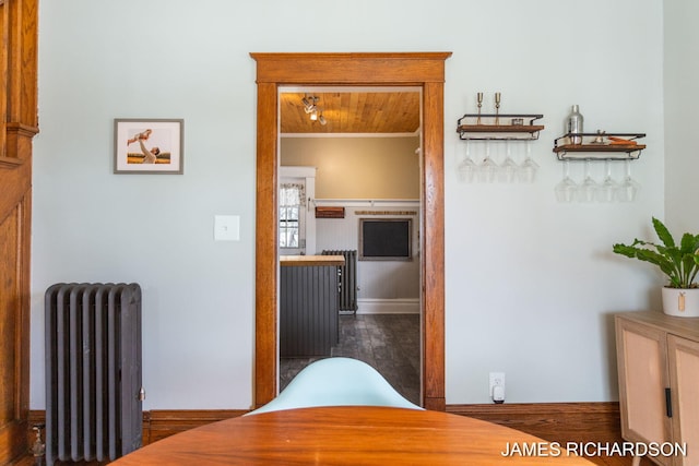 hallway featuring ornamental molding and radiator