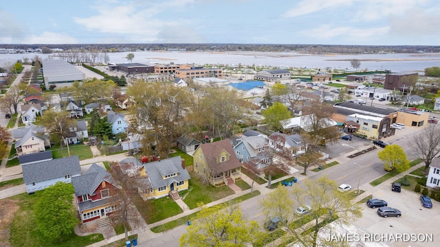 aerial view featuring a water view and a residential view