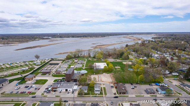 birds eye view of property with a water view and a residential view