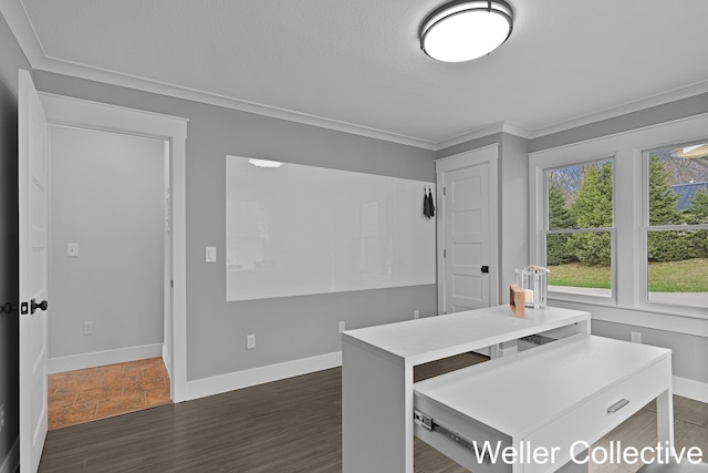 dining area with crown molding, baseboards, and dark wood-style floors