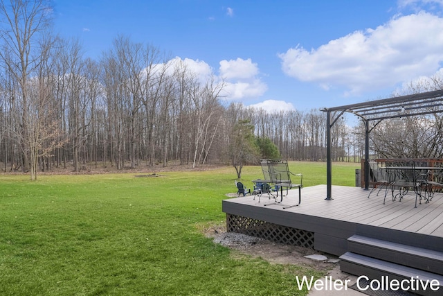view of yard with a pergola and a deck
