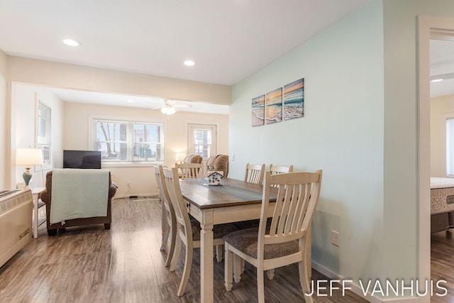 dining space with ceiling fan, recessed lighting, and wood finished floors
