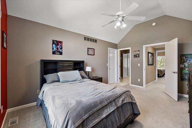 bedroom with baseboards, light colored carpet, lofted ceiling, and visible vents