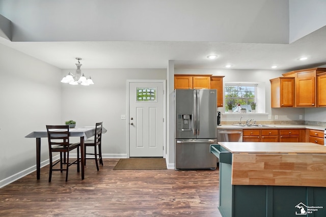 3325 Saint Anthony Rd, Temperance, MI 48182 - kitchen with appliances with stainless steel finishes, a sink, a chandelier, dark wood-type flooring, and recessed lighting