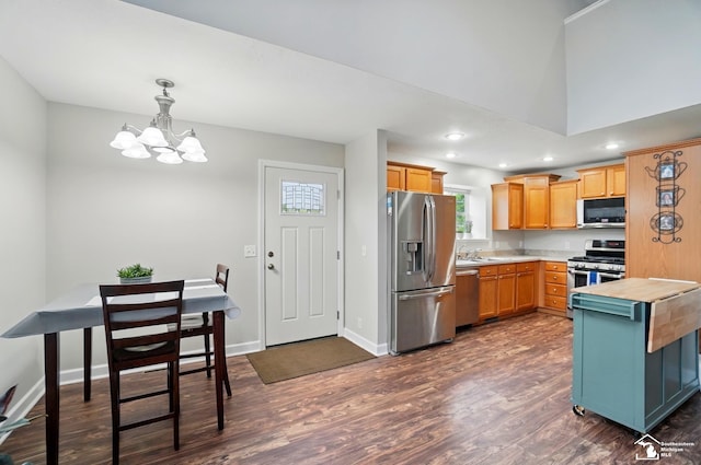 3325 Saint Anthony Rd, Temperance, MI 48182 - kitchen with appliances with stainless steel finishes, a chandelier, dark wood-style flooring, a sink, and baseboards