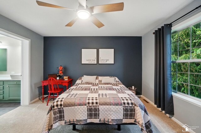 3325 Saint Anthony Rd, Temperance, MI 48182 - bedroom featuring carpet flooring, connected bathroom, baseboards, and a ceiling fan