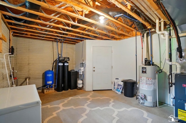 3325 Saint Anthony Rd, Temperance, MI 48182 - unfinished below grade area featuring water heater, a water softener system, a water pressure tank, and white fridge
