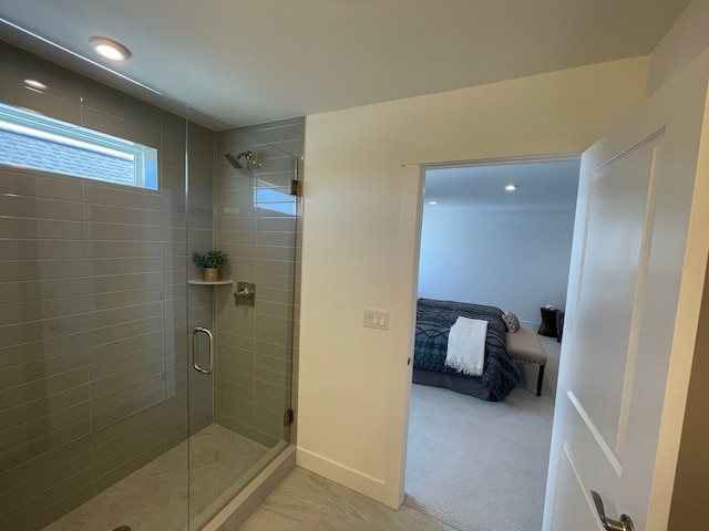ensuite bathroom featuring recessed lighting, ensuite bath, and a shower stall