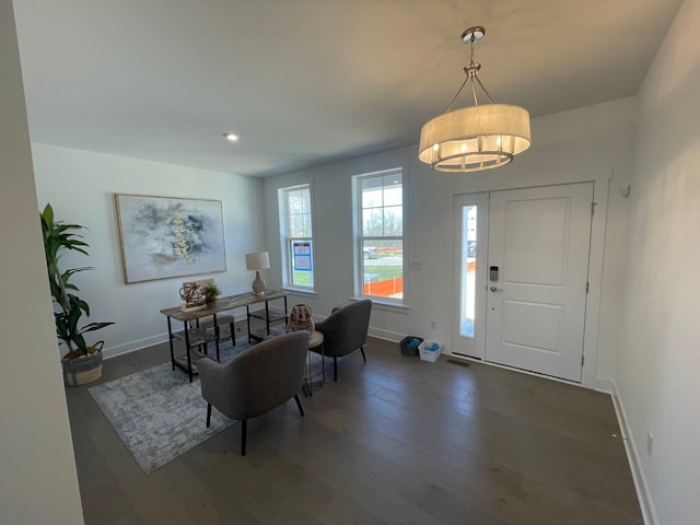 foyer featuring recessed lighting, baseboards, dark wood finished floors, and an inviting chandelier
