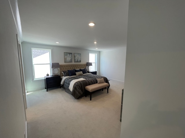 bedroom with recessed lighting, baseboards, and light colored carpet
