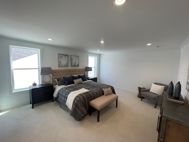 bedroom with recessed lighting, baseboards, and light carpet