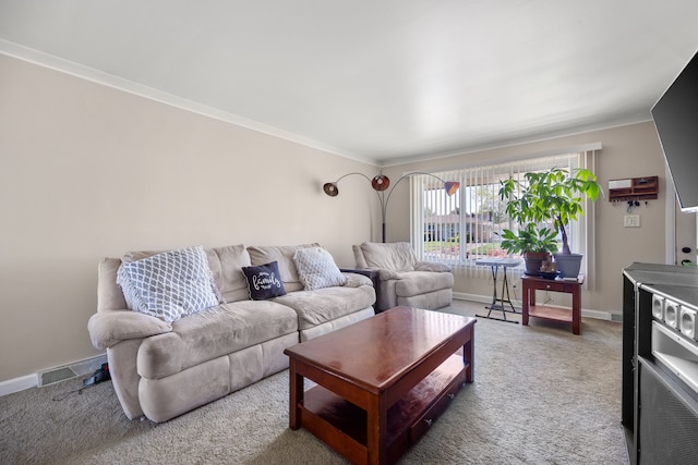 carpeted living area with ornamental molding and baseboards