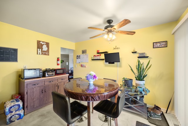 dining room with a ceiling fan