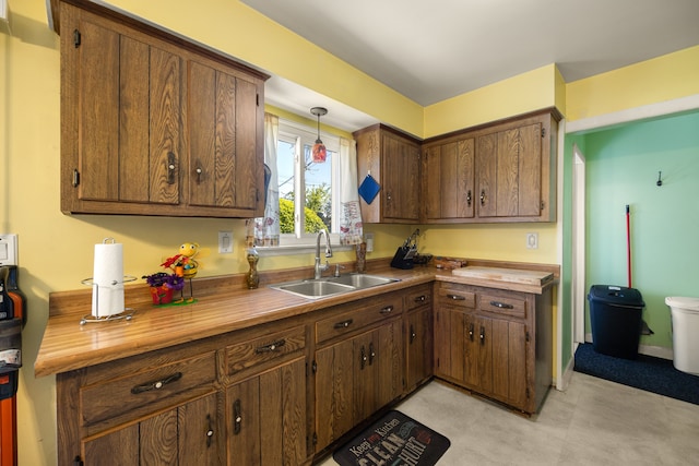 kitchen featuring a sink and hanging light fixtures