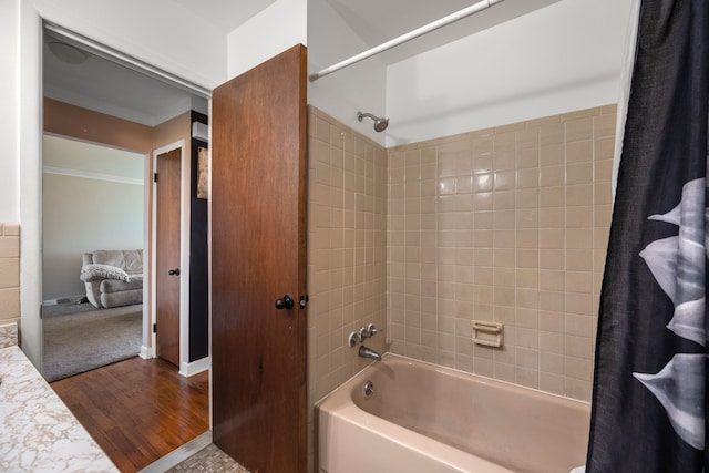 full bathroom featuring shower / bathtub combination with curtain and wood finished floors