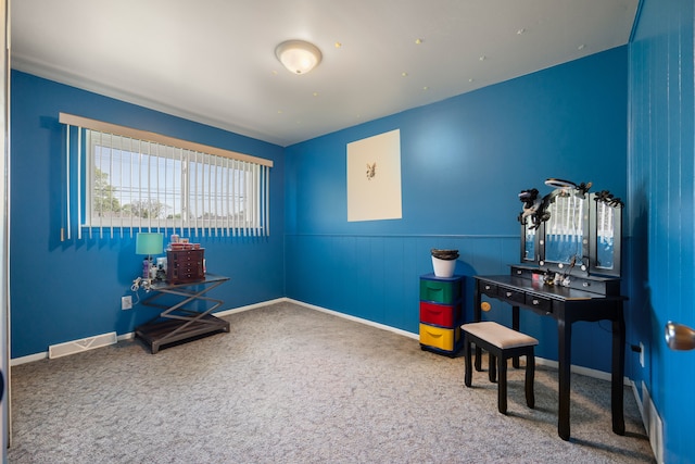 sitting room with carpet, wainscoting, and baseboards