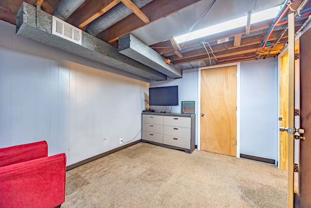 finished basement featuring carpet and baseboards
