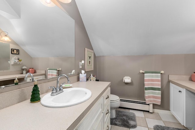 bathroom with vanity, a baseboard radiator, lofted ceiling, and toilet