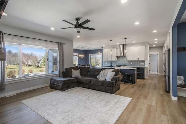 46140 Finch St, Mattawan, MI 49071 - living room featuring ceiling fan, light wood-style floors, recessed lighting, baseboards, and visible vents