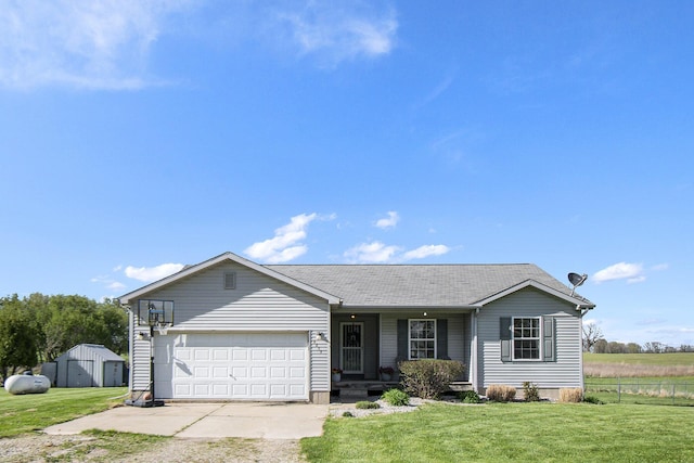 single story home with fence, covered porch, a front yard, an attached garage, and driveway