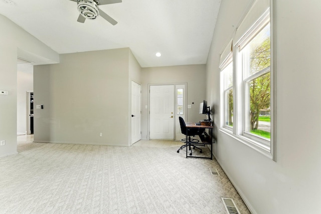 office area with a ceiling fan, baseboards, visible vents, and light carpet