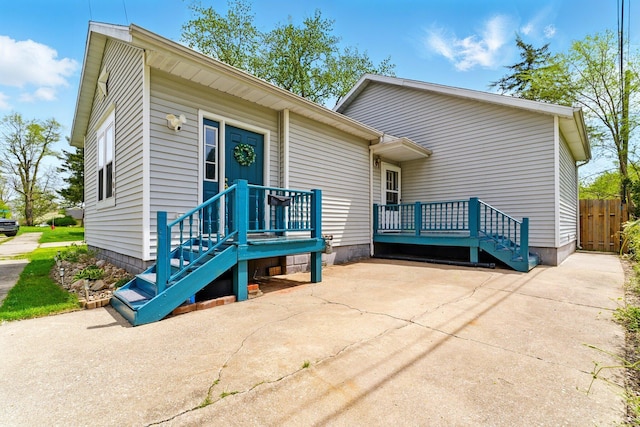 view of front of house featuring fence