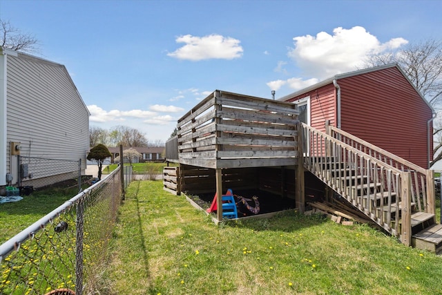 view of property exterior featuring a lawn, a fenced backyard, and stairway