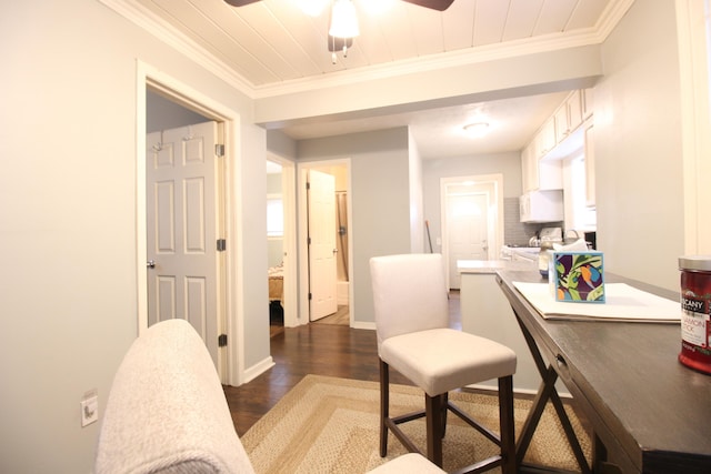office featuring ceiling fan, ornamental molding, baseboards, wooden ceiling, and dark wood-style floors