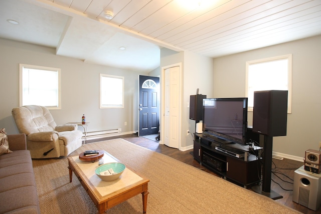 living room featuring baseboards, baseboard heating, and dark wood-type flooring