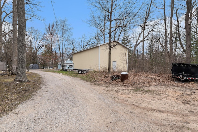 view of road with driveway