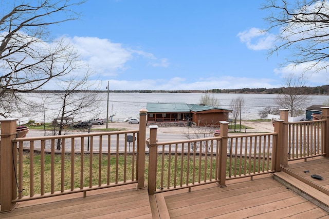 wooden deck with a water view
