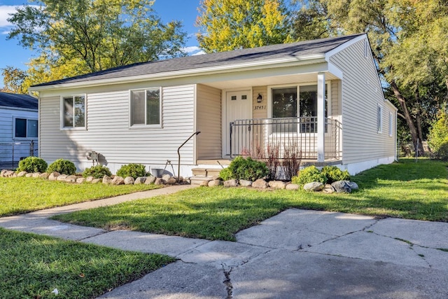 37451 Carpathia Blvd, Sterling Heights, MI 48310 - bungalow-style home featuring a porch and a front yard
