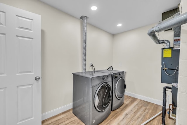 37451 Carpathia Blvd, Sterling Heights, MI 48310 - laundry room with baseboards, laundry area, washer and clothes dryer, and light wood-style floors