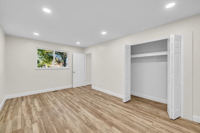 37451 Carpathia Blvd, Sterling Heights, MI 48310 - unfurnished bedroom featuring baseboards, recessed lighting, light wood-style flooring, and a closet