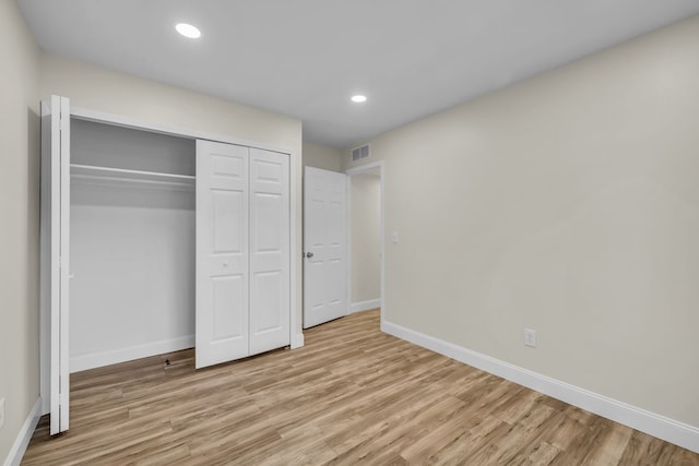 37451 Carpathia Blvd, Sterling Heights, MI 48310 - unfurnished bedroom featuring visible vents, baseboards, wood finished floors, and a closet