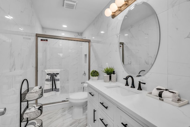 37451 Carpathia Blvd, Sterling Heights, MI 48310 - bathroom with tile walls, vanity, toilet, marble finish floor, and a marble finish shower
