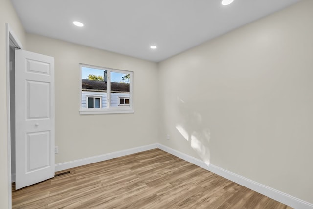 37451 Carpathia Blvd, Sterling Heights, MI 48310 - spare room with baseboards, recessed lighting, light wood finished floors, and visible vents