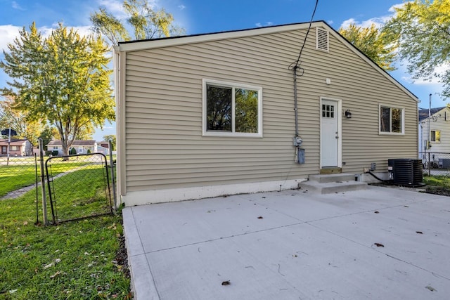 37451 Carpathia Blvd, Sterling Heights, MI 48310 - back of house featuring a lawn, a gate, fence, cooling unit, and a patio