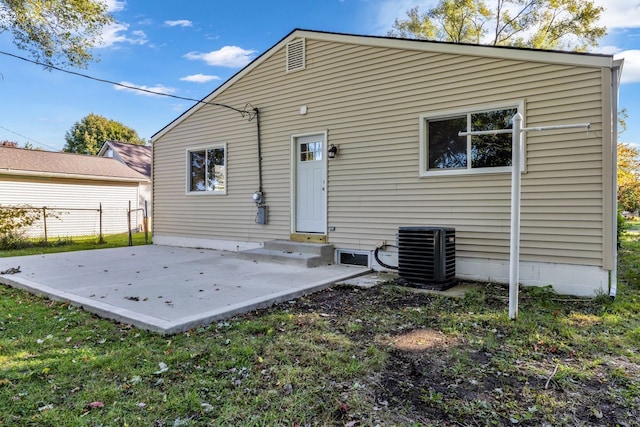 37451 Carpathia Blvd, Sterling Heights, MI 48310 - back of property featuring fence, central AC unit, a patio area, entry steps, and a lawn