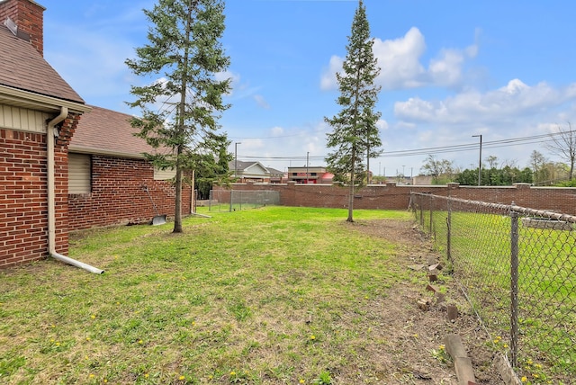 view of yard with a fenced backyard