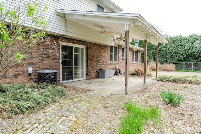 view of patio featuring central air condition unit, ceiling fan, and fence